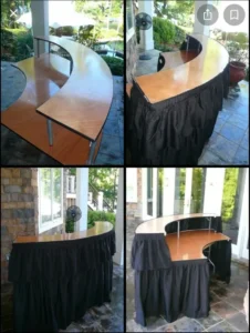 A table with black cloth and wooden top