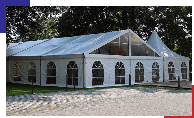 A large white tent with many windows on the side.